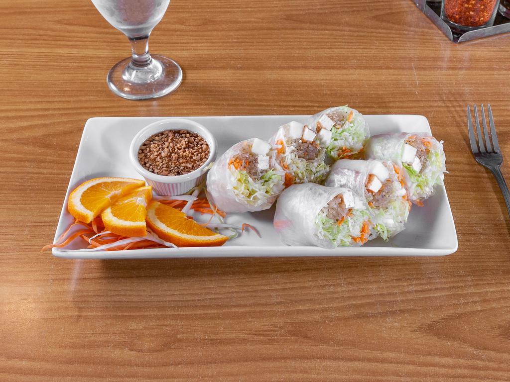 Peculiar Rolls  · Fresh spring rolls made with cream cheese, shrimp, crab meat, fresh carrots, and lettuce rolled with rice paper.