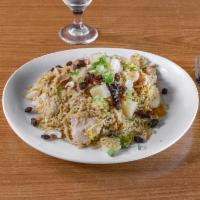 Pineapple Fried Rice  · Traditional fried rice made with chunks of pineapple, egg, and a combination of shrimp and c...