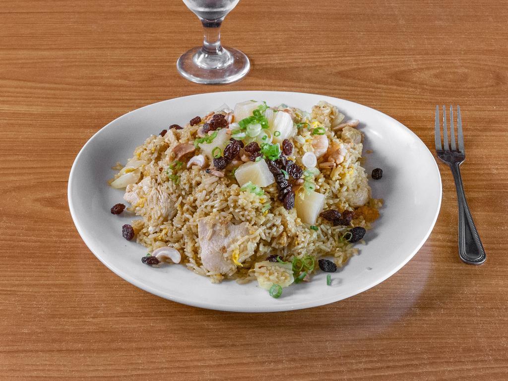 Pineapple Fried Rice  · Traditional fried rice made with chunks of pineapple, egg, and a combination of shrimp and chicken, roasted cashew nuts, raisins and scallions.