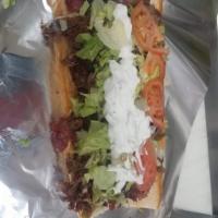 Large  Gym shoe  sandwich with freis pop · Gyro sause onion Tomatoe mayonnaise lettuce jardinera 