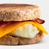 Breakfast Sandwich · 4 egg whites, turkey bacon, low-fat cheddar. Served on Ezekiel English muffin and side of fr...