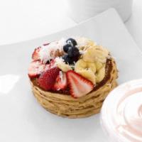 Mayra's Vegan Protein Pancakes · Organic homemade pancakes topped with blueberries, strawberries, banana, and coconut. Vegan.