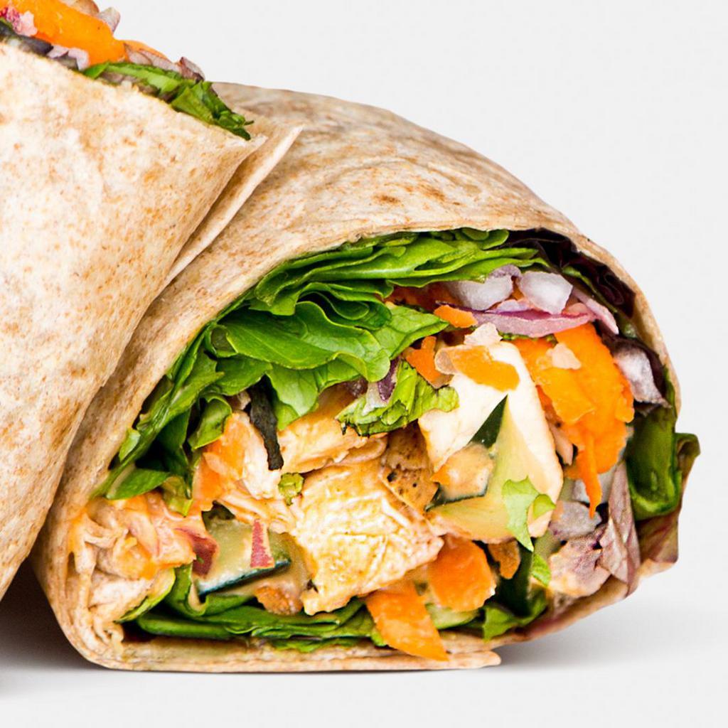 Spicy Thai Chicken Wrap · Grilled all-natural chicken, romaine lettuce, red onions, cucumbers, carrots, basil, mint, chopped peanuts, peanut sauce.