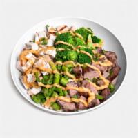 Thai Monster Bowl · All-natural chicken, certified Angus beef steak, broccoli, asparagus, green onions, and hous...