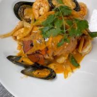 Curry Seafood · Lobster tail, sea scallop, shrimp, mussels and vegetables in red curry sauce.