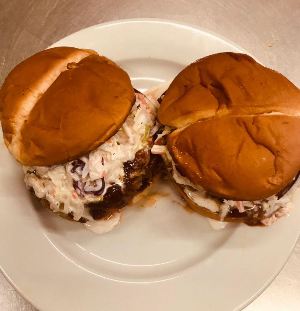 Pull Pork Sandwich · A Smoked Pork Butt topped with Wesley's BBQ sauce and coke slaw. 
Comes with your choice of fries, beans, or chips. 