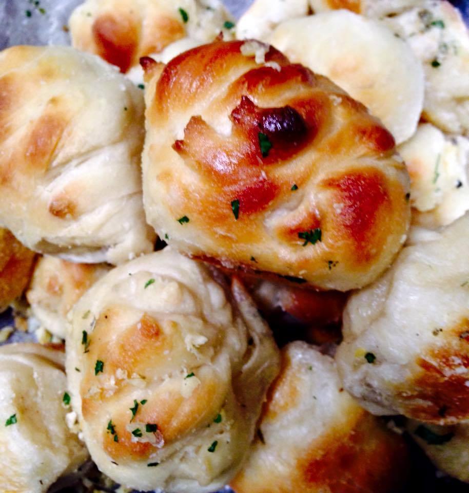 6 Piece Garlic Knots · Twists of dough covered with garlic and Romano cheese.