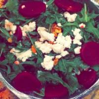 Beet Salad · Arugula, beets, walnuts and goat cheese in a balsamic vinaigrette dressing.