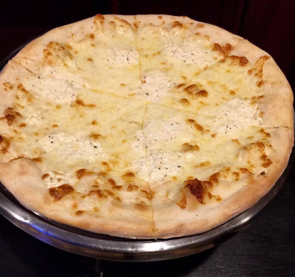 Pizza Bianca · No sauce. Ricotta, mozzarella cheese, fresh broccoli and tomato.