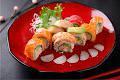 Rainbow Roll · Crab and avocado with fresh fish on top with house sauce.