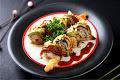  Dragon Roll · Shrimp tempura, spicy tuna, crab and crunch with eel, avocado on top. Spicy.