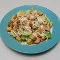 Chicken Caesar Salad · Romaine lettuce, seasoned chicken, homemade croutons and Parmesan cheese.