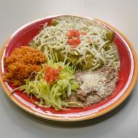 Enchiladas · 3 wrapped tortillas dipped into red or green sauce and topped with melted cheese. Served wit...