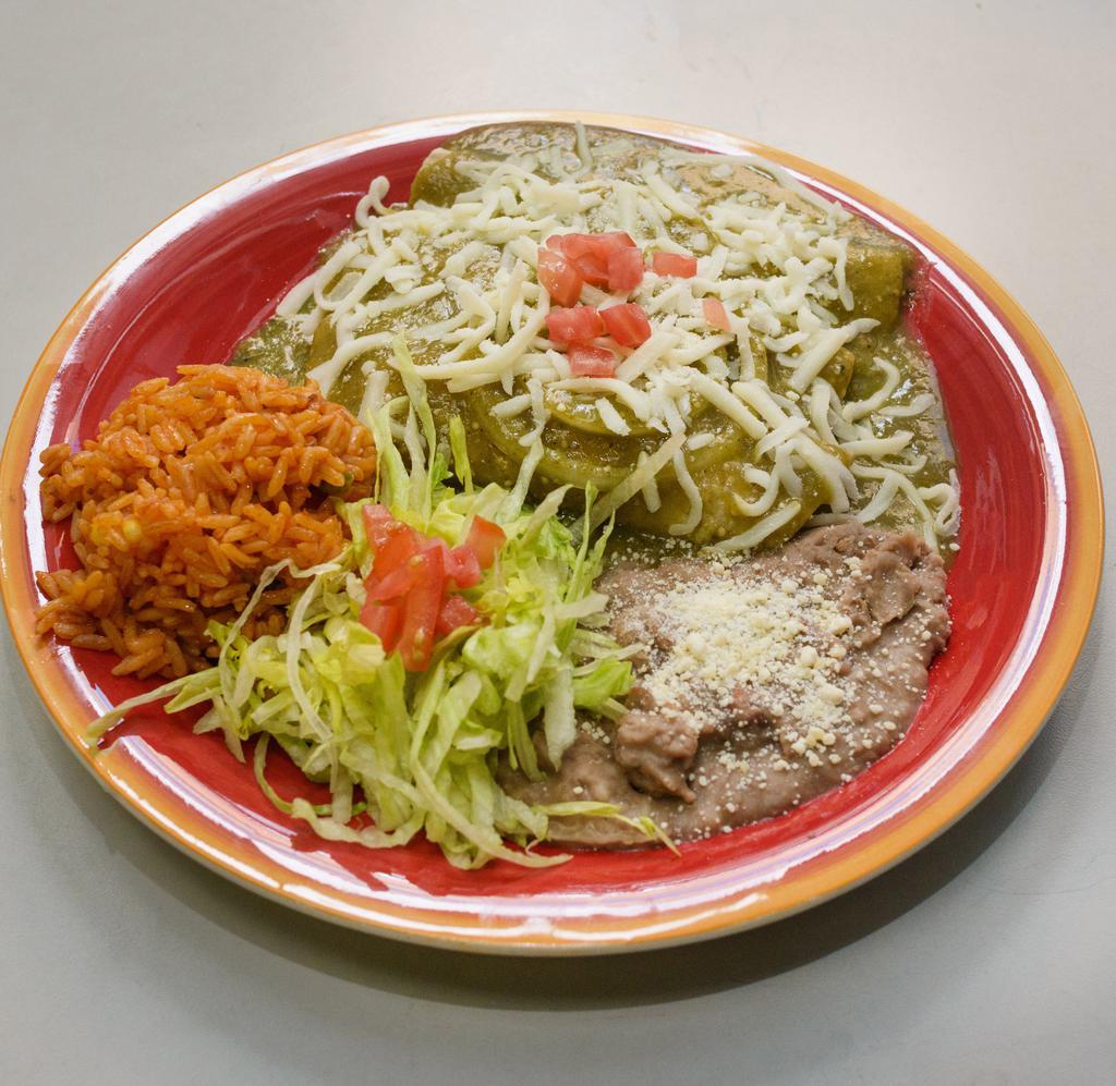 Enchiladas · 3 wrapped tortillas dipped into red or green sauce and topped with melted cheese. Served with salad, rice, and beans.