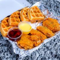 Chicken and Waffles · Deliciously seasoned chicken wings served with 1 Belgium style waffle and choice of 1 side.