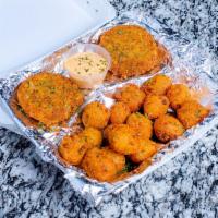 Crab Cakes · 2 perfectly Creole seasoned crab cakes served with hush puppies and choice of 1 side.