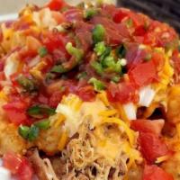 Loaded Tater Totos · Tater tots loaded with pulled chicken, cheddar cheese, craft beer cheese, jalapeno, diced on...