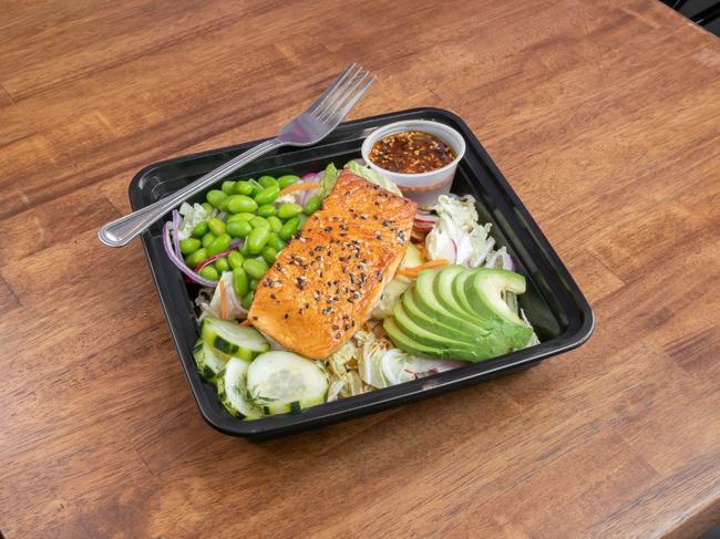 Asian Salmon Salad · Seared ponzu glazed salmon on our house blended Asian mix with avocado, pickled cucumbers, and edamame
