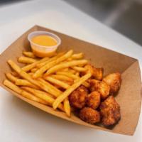 Chicken Nugget Basket · Crispy panko chicken nuggets and a side of fries with your choice of sauce