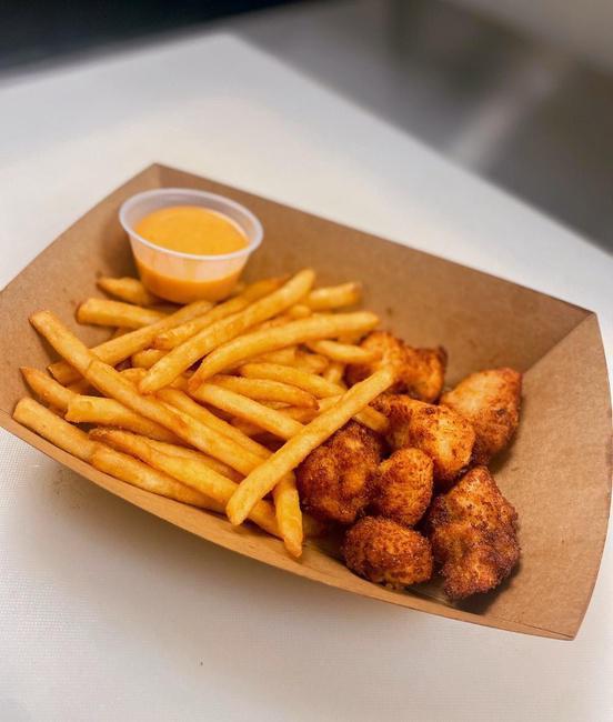 Chicken Nugget Basket · Crispy panko chicken nuggets and a side of fries with your choice of sauce