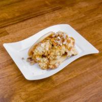 Peach Cobbler Bao · Southern style peach cobbler inside a fried bao sprinkled with powdered sugar and candied wa...
