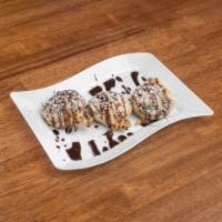 Oreo Tempura · Delicious Oreo tempura drizzled with chocolate syrup and sprinkled with powdered sugar