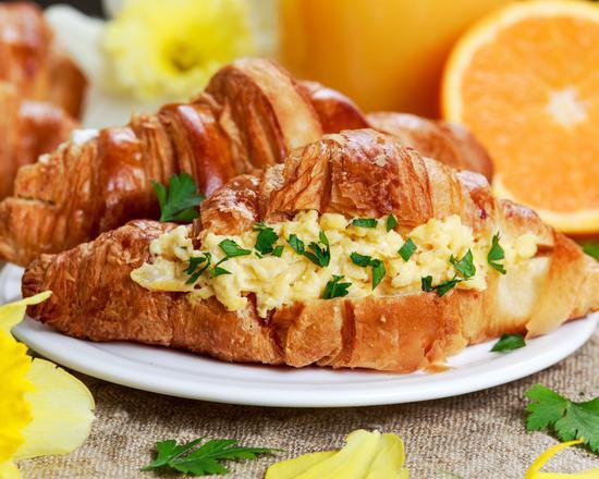 2 Eggs on Croissant · Fresh buttermilk croissants filled with eggs.