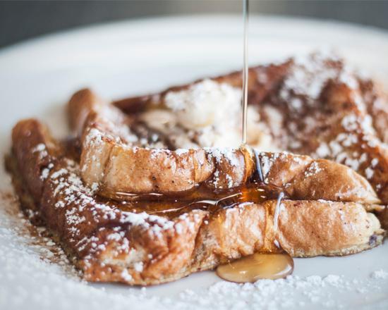 French Toast with Syrup · Fresh fluffy French toast topped with syrup.
