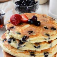 Blueberry Pancakes · 2 pieces. Fluffy buttermilk pancakes with blueberries and syrup.