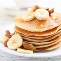 Banana Pancakes · 2 pieces. Fluffy buttermilk pancakes topped with slices of fresh banana.