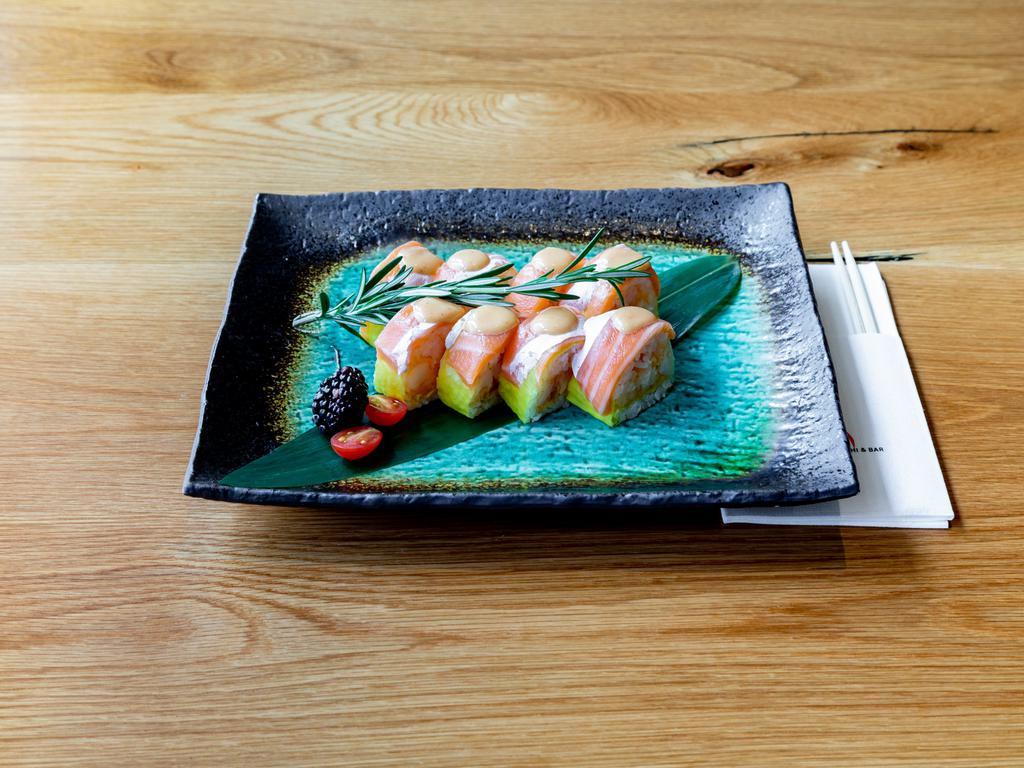 Prince Roll · Rock shrimp tempura inside topped with salmon, soy paper, and spicy sauce.