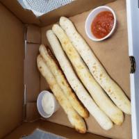 GARLIC PIZZA STICKS · 5 Pizza Sticks with Garlic Oil Flavor, served with Ranch Dressing and Marinara Sauce