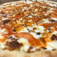 Buffalo Chicken Pizza · Ranch dressing base with mozzarella, sauteed shallots, bacon, tomatoes, and chicken tossed i...