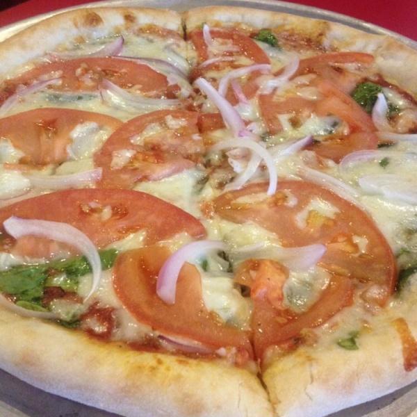 Veggie Pizza · Fresh spinach, mozzarella, tomatoes, fresh garlic, red onions, mushrooms and fresh basil. Vegetarian.