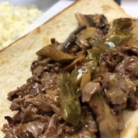 Philly Steak Sandwich · Fresh homemade top round steak with green peppers, onions, mushrooms, American and provolone...