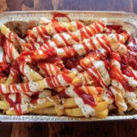 24. French Fries · Fries, ketchup, hot sauce, and white sauce.