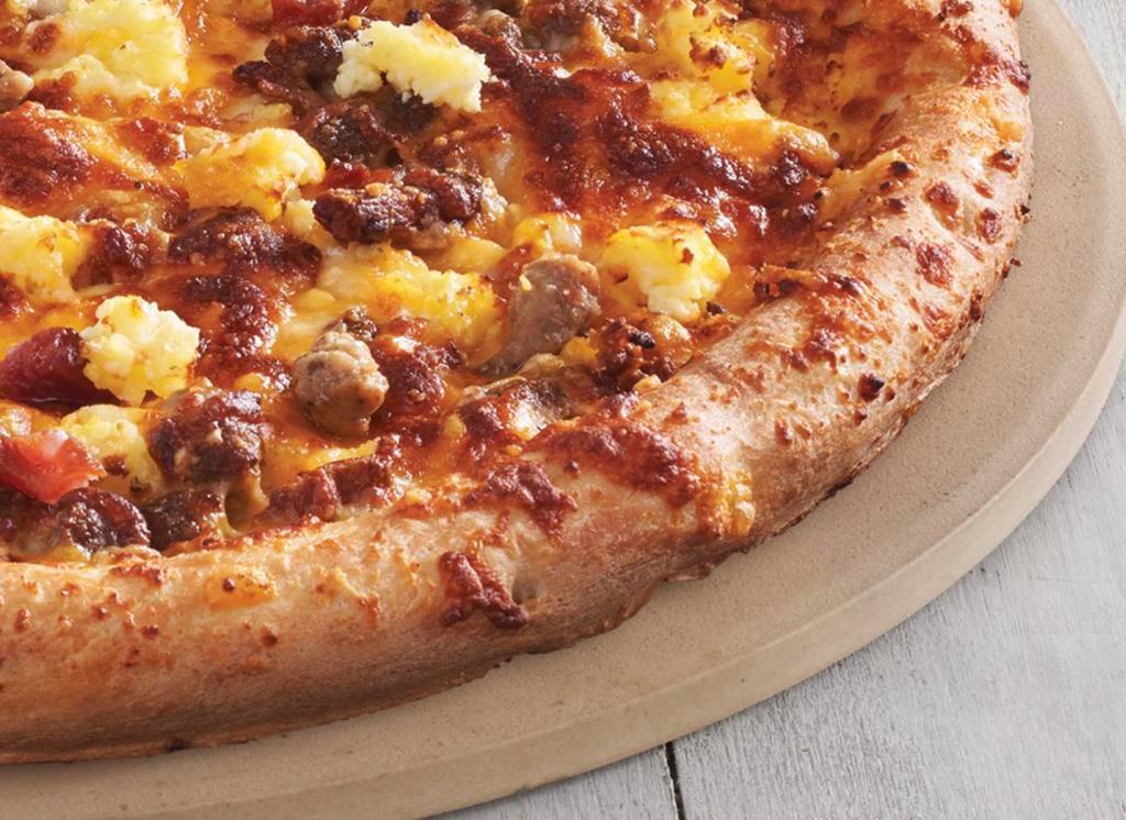 Breakfast Pizza · Original crust (8 slices). Scrambled eggs, breakfast sausage, bacon, mozzarella and cheddar cheese on a buttered crust.