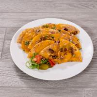 Super Nachos · Your choice of beef fajita, chicken fajita or chopped brisket. Served with lettuce, tomato a...