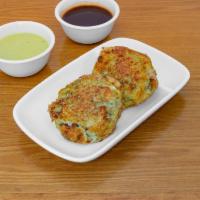 Potato Patties · Mashed potato patties mixed with coriander, peas, and spices, fried in oil.
