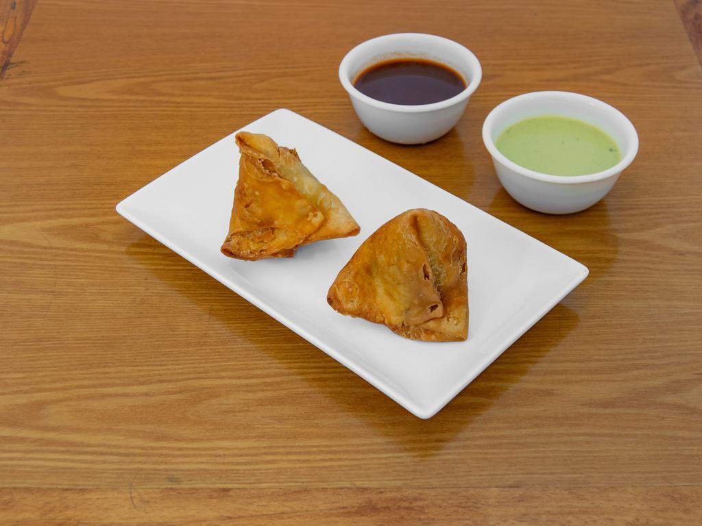 Beef Samosa · A fried pastry with a savory beef filling.