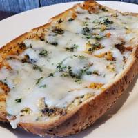 Garlic Bread with Cheese · Buttery bread that is topped with garlic and cheese.