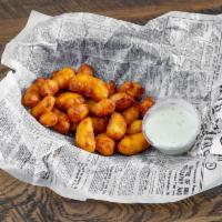 Battered Wisconsin White Cheddar Cheese Curds · You have to! It's Wisconsin! Served with ranch.