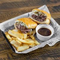 Prime Rib French Dip Sandwich · This is a house favorite. Thin sliced roasted prime rib served with aus jus and one side.