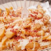 Dirty (MF) Fries · French fries slathered with garlic and parmesan sauce, layered mozzarella cheese, topped wit...