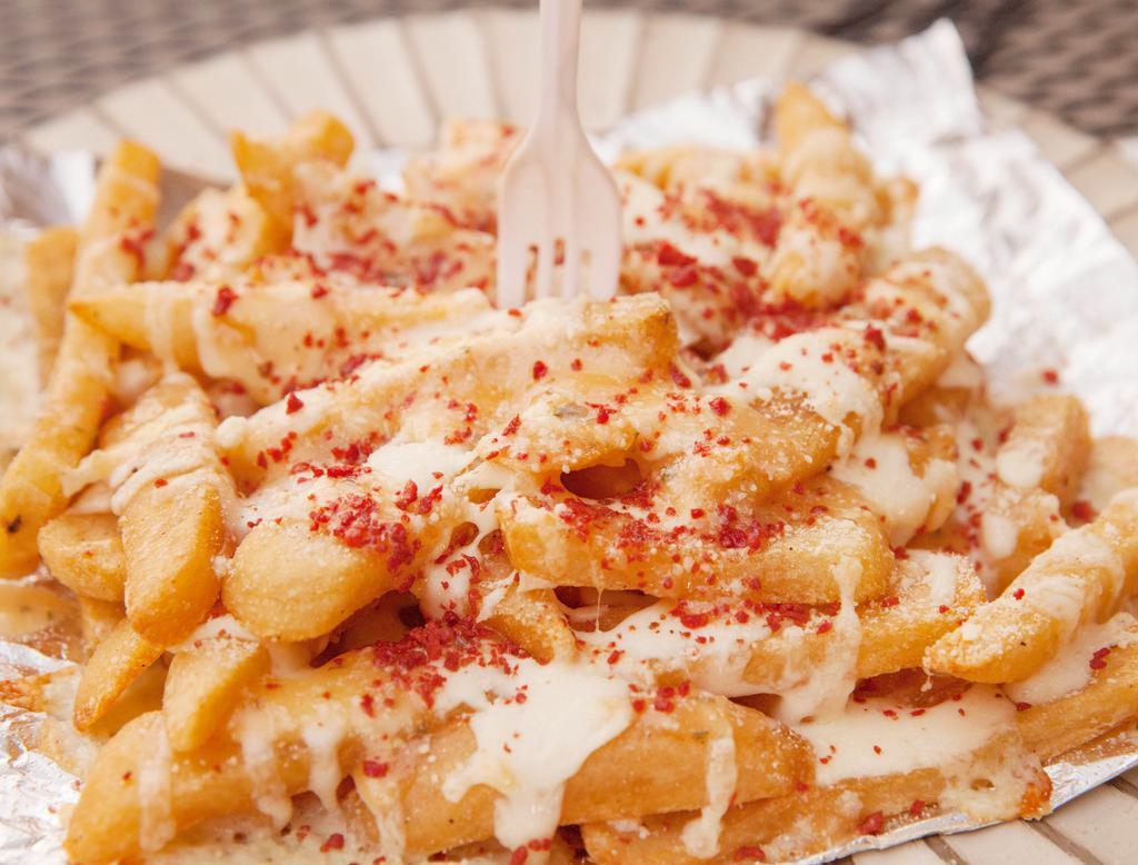 Dirty (MF) Fries · French fries slathered with garlic and parmesan sauce, layered mozzarella cheese, topped with soy bacon bits and parmesan cheese and a soda of choice.