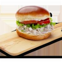 Chicken Salad Sandwich Combo · Chicken salad, sliced tomato, lettuce and mayo on a brioche bun. Served with regular side an...
