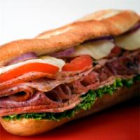 Italian Grinder · Ham, old fashioned loaf and Genoa salami. Dressed with provolone cheese, lettuce, tomato, on...