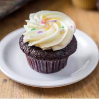 Classic Molly's Chocolate Cupcake · Picture shows our classic chocolate cupcake with buttercream frosting and sprinkles.
