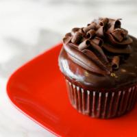 Chocolate Decadence Cupcake · Chocolate cake, chocolate mousse filling and chocolate ganache.