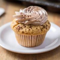 Peanut Butter Nutella Cupcake · Peanut butter cake, Nutella filling, Nutella buttercream frosting and a dusting of cocoa.
